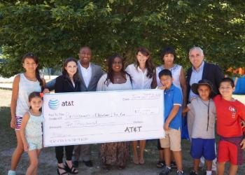 AT&T's Marissa Shorenstein and Brandon V. Ray, Bonnie Michelle Cannon, Southampton Town Supervisor Anna Throne-Holst, Board Member Gloria Harris, Suffolk County Legislator Jay Schneiderman and BCC&RC kids.
