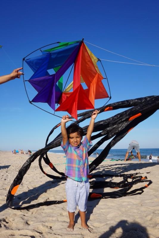 Kalu Zuniga who won the prize for the biggest kite, the octopus behind him