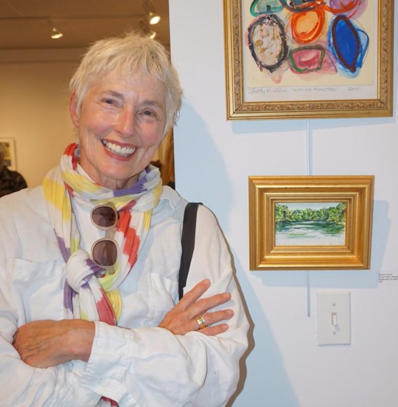 Artist Elaine Grove with her work