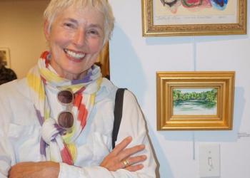 Artist Elaine Grove with her work