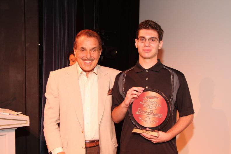 Chairman of Barnes and Noble Booksellers Len Riggio poses with the $3,000 grand prize winner