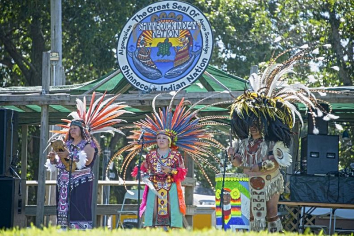 Under the shield of the Shinnecock Nation, Aztec performers play drums, flutes, conch and sing in a special opening performance depicting folklore stories.