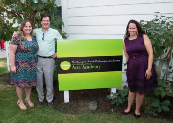 WHBPAC Director of Arts Education Julienne Penza Boone, Executive Director James Burke, and Marissa Russo, the WHBPAC arts education manager, unveil the new logo for the Nancy and Frederick DeMatteis Art Academy