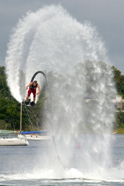 Seemingly fearless, flyboarder Dane Rive flies through the air on water jets.