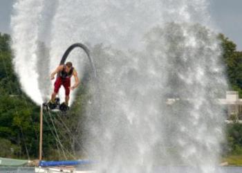Seemingly fearless, flyboarder Dane Rive flies through the air on water jets.