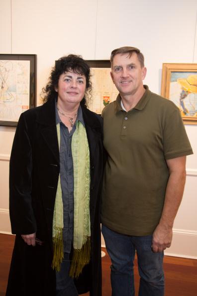 Ellen Dooley and Tom Steele stand among their works