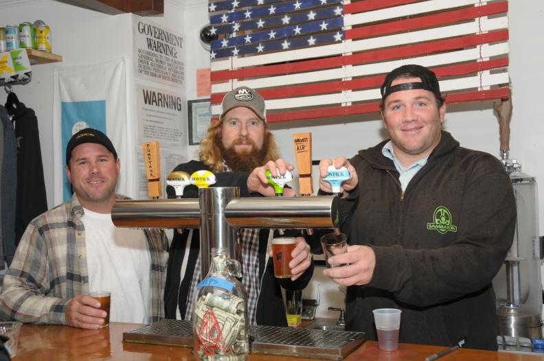 Art enthusiasts Bob Murphy, Kyle Lawrence and Mike Rogers practiced the art of serving beer