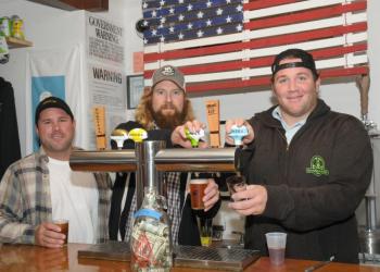 Art enthusiasts Bob Murphy, Kyle Lawrence and Mike Rogers practiced the art of serving beer