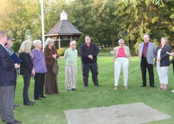 Local dignitaries and committee members spoke briefly with attendees before unveiling the time capsule