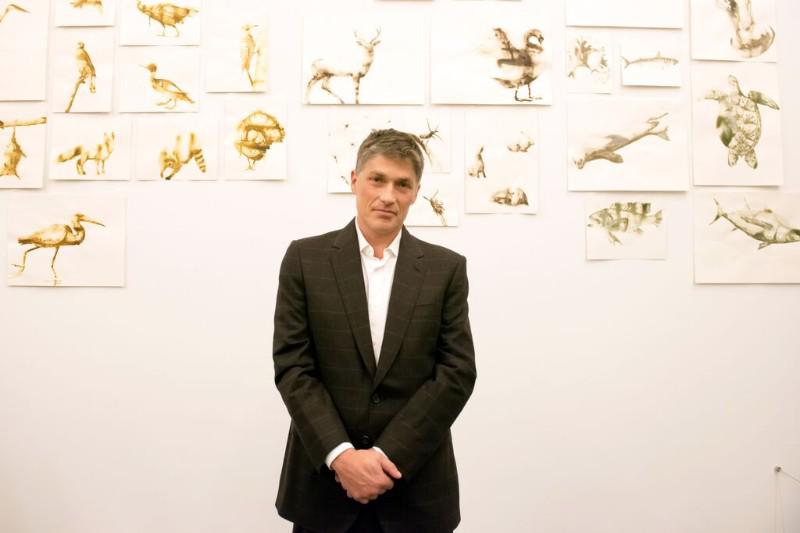 Alexis Rockman, artist, with his work.