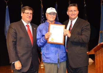Southampton Village Trustee Richard Yastrzemski, veteran honoree Chet Yastrzemski and Mayor Mark Epley