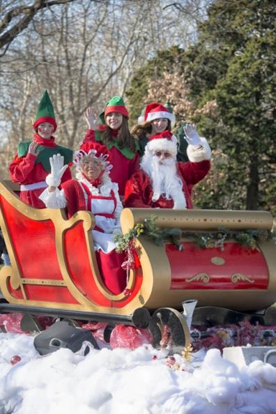 Three elves, Mrs. Claus and Santa Claus himself, or maybe its Dan Rattiner under that beard?
