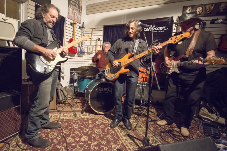 Jamming with friends, guitarists Andy Aledort, Klyph Black and Randolph Hudson with drummer Richard Rosch, played together at Crossroads Music