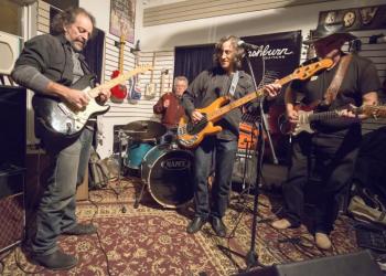 Jamming with friends, guitarists Andy Aledort, Klyph Black and Randolph Hudson with drummer Richard Rosch, played together at Crossroads Music  