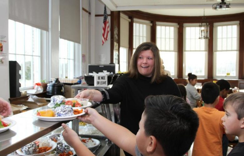Board of Education member Kathleen McCleland was on hand to help serve lunches to the students