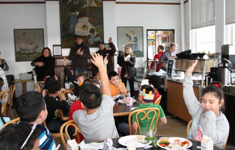 Chef Jason Weiner and Sean Barrett led the students in a fishburger cheer as they introduce the Montauk Fishburger to them