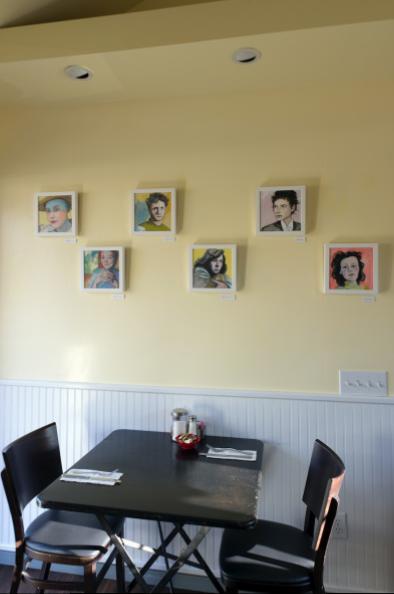 The walls of Estia's Little Kitchen are currently graced with the bright and imaginative portraits of literary persons from John Steinbeck to local writer and poet, Scott Chaskey, the work of painter Valerie Suter.