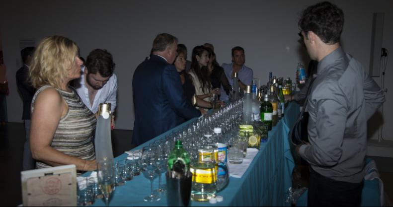 Guests enjoying drinks during the 2016 Midsummer Party at Parrish Art Museum.
