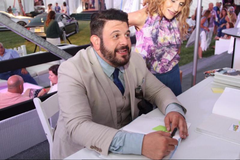 Adam Richman signing his book in the VIP lounge at Grillhampton