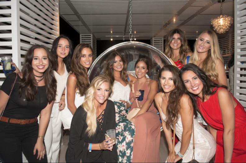 Floating in a Glaceau Smart Water bubble chair, Ashley Acosta and Alcee Metevier, taking it easy looked like so much fun, all the pretty girls jumped in too!