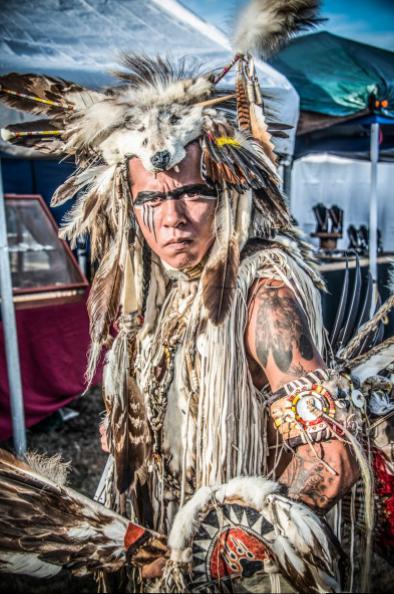 The fiersome looking Cody Coe of the South Dakota tribe, Sisseton Wahpeton, in full ceremonial regalia