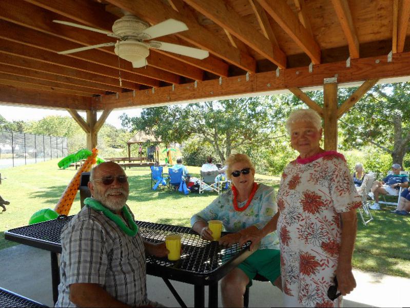 Greenwood Village community members enjoying the nice weather before watching the Ed Travers band play