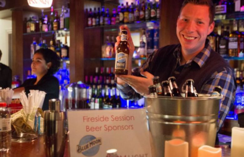 Peter Barred shows off some Blue Moon beer