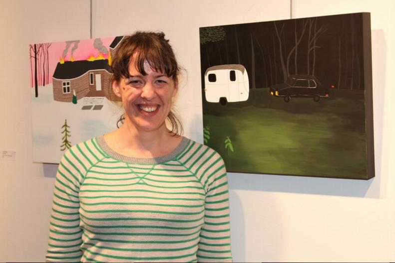 Founding Bonac Tonic artist and show curator Carly Haffner with her folk inspired paintings