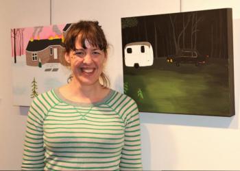 Founding Bonac Tonic artist and show curator Carly Haffner with her folk inspired paintings