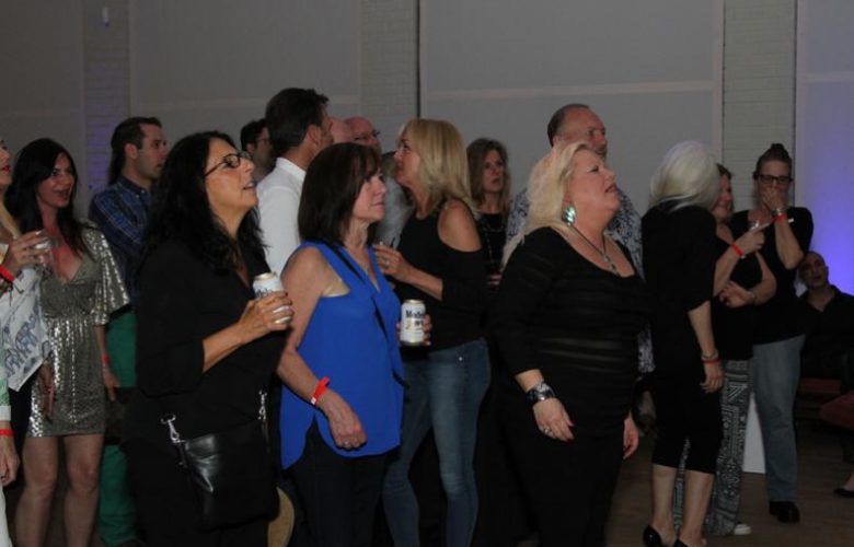 Crowd singing along to songs