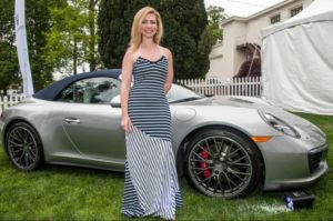 Jennifer Piacenti with one of the Porsche sports cars.