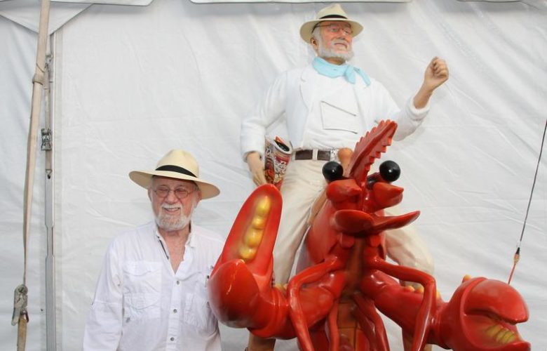 Dan Rattiner in front of himself riding a lobster