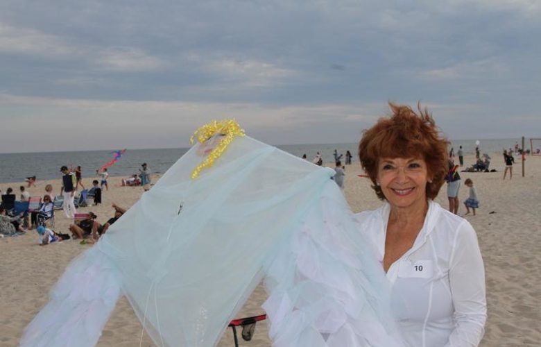 Lucy Rubin, current Dan's Papers cover artist, signed copies of our magazine and showed off the custom kite she made