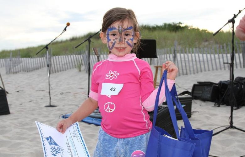 Winner of "Most Colorful Kite" with her butterfly kite, Teddy