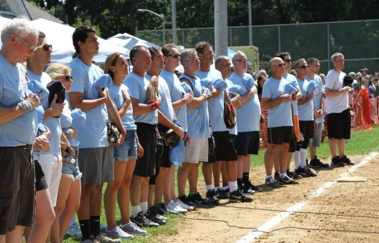 Writers team stand for the National Anthem