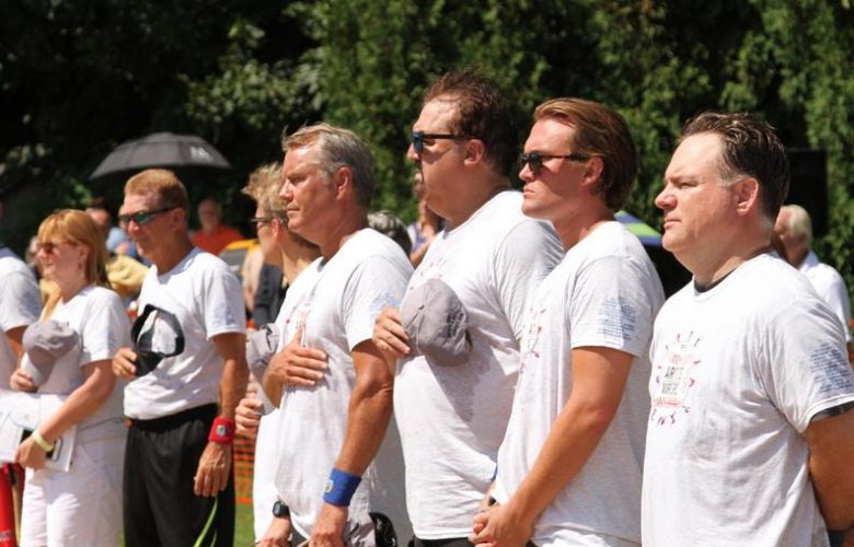 Artists team standing proud for the National Anthem