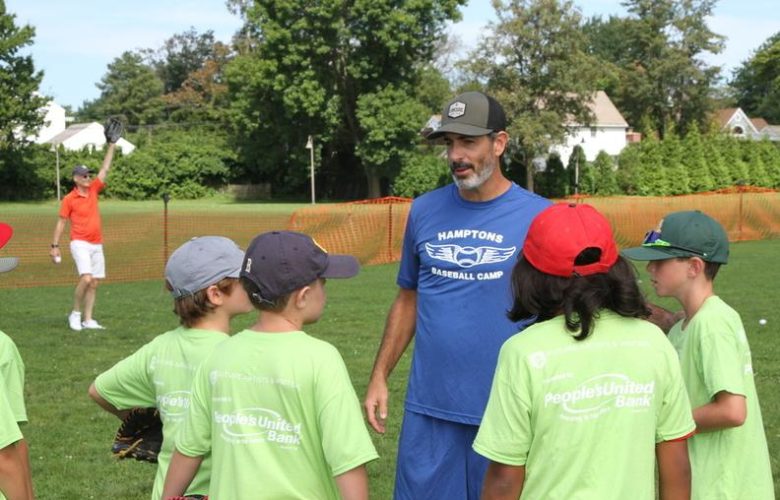 Coaches from Hamptons Baseball Camp instructed children with proper throwing, hitting and running techniques