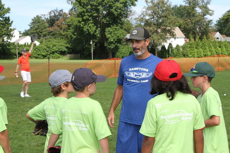 Coaches from Hamptons Baseball Camp instructed children with proper throwing, hitting and running techniques
