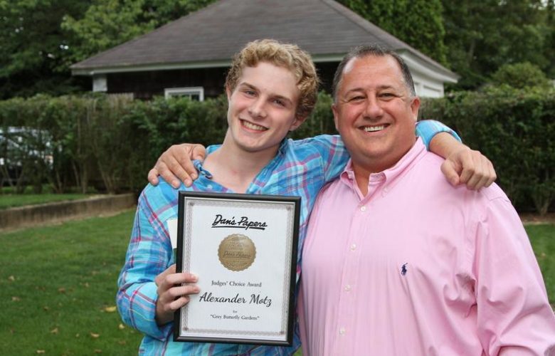 Judges' Choice Award Winner Alexander Motz is congratulated by CEO and Editorial Director at Dan's Hamptons Media Eric Feil