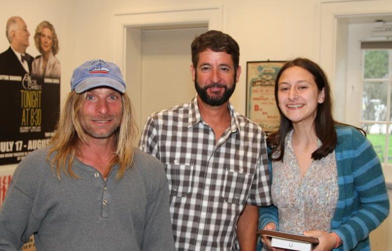 Jordan Ferdman, second place winner for Emerging Young Writers is congratulated on her win by Montauk-based authors Anthony Sosinski and John Aldridge