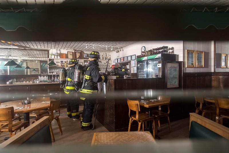 Firefighters inside John Papas