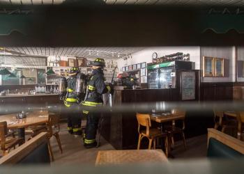 Firefighters inside John Papas