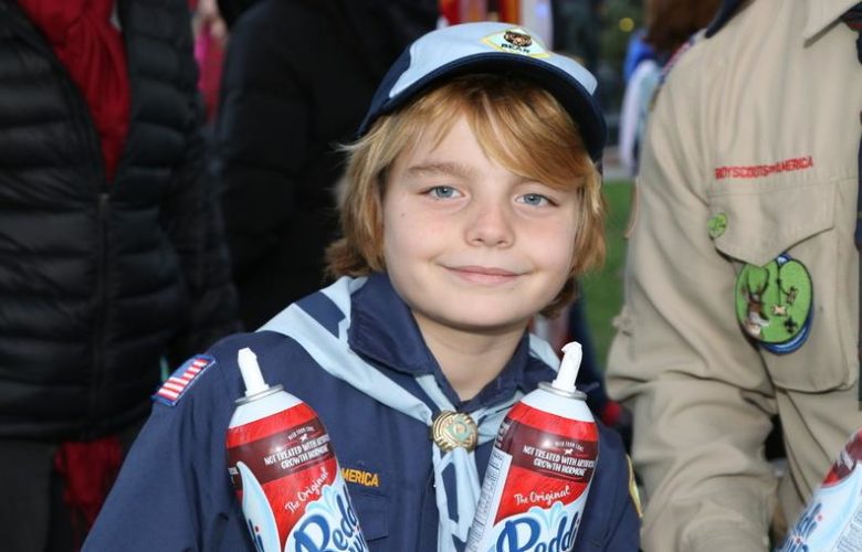 Boy Scout William age 8, was in charge of topping the hot chocolate with whipped cream