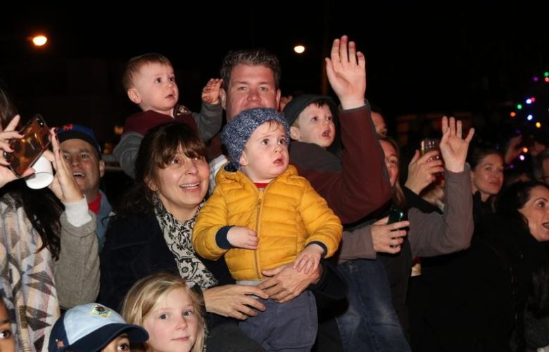 All eyes were on Santa as he rode by on the fire truck