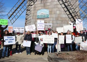 Posing in front of the iconic windmill in Sag Harbor