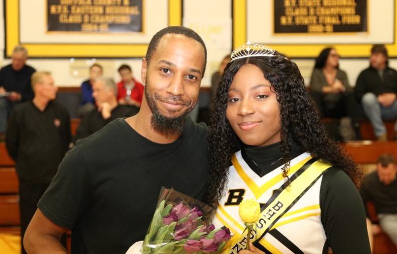 Autumn Street is presented flowers by a family member as she is recognized as a graduating senior