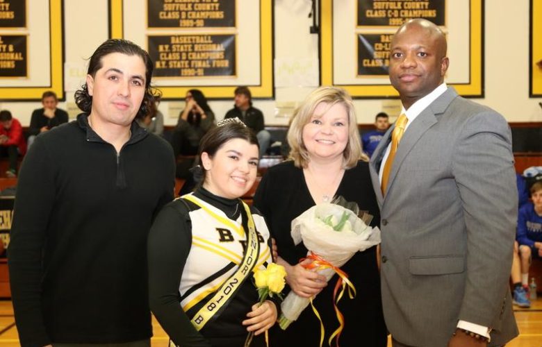 The Maldonado Family poses with Head Coach Ron White