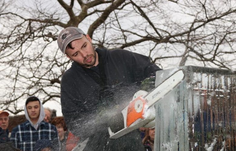 Ice Memories Inc., Long Island's most award-winning ice sculpture company, created numerous ice sculptures that adorned the streets of Sag Harbor for the festival. Pictured, founder of Ice Memories Inc. Rich Daly, takes to the ice