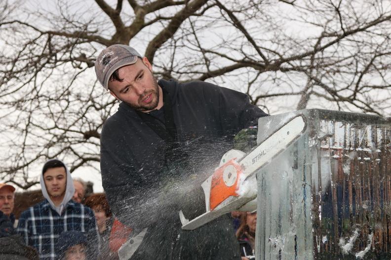 Ice Memories Inc., Long Island's most award-winning ice sculpture company, created numerous ice sculptures that adorned the streets of Sag Harbor for the festival. Pictured, founder of Ice Memories Inc. Rich Daly, takes to the ice
