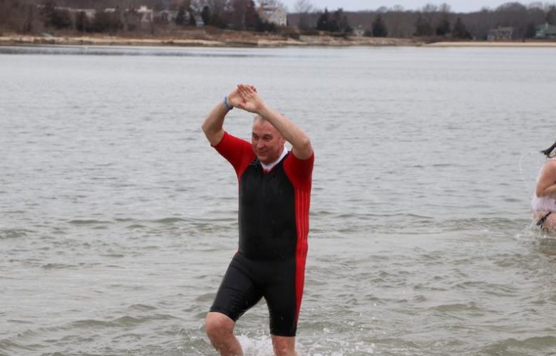 Hands in the air for all who participated in the Frosty Plunge